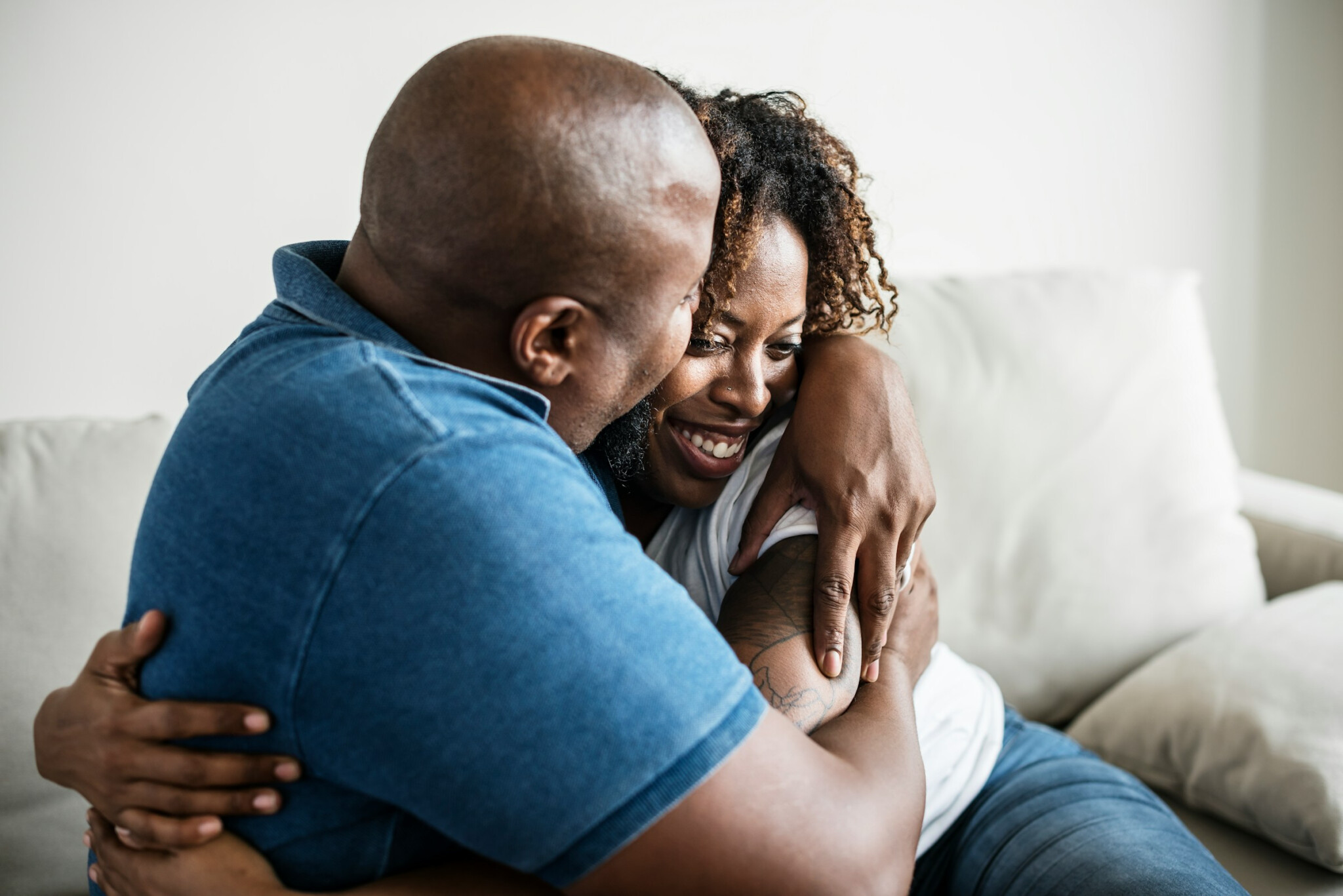 Group Of Humans, Healthspan Image, A husband and wife cuddling on the couch